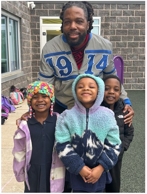 Dr. Payne with 3 young students