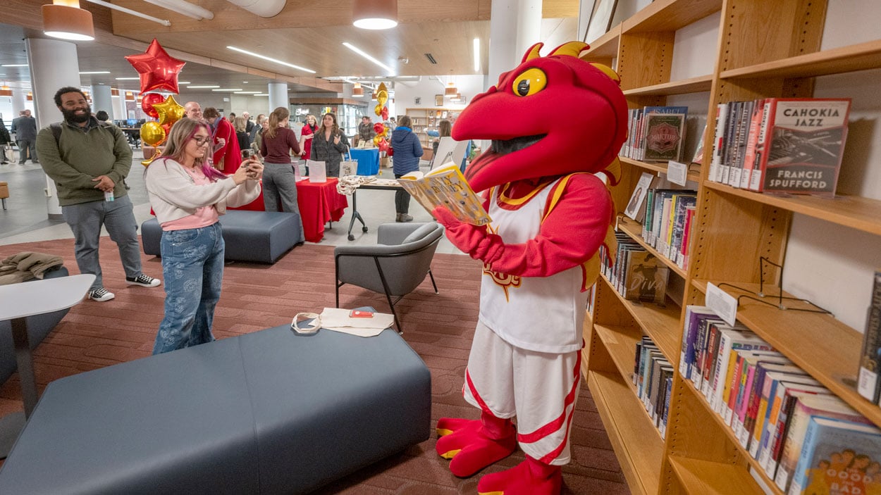 Mascot reading a book